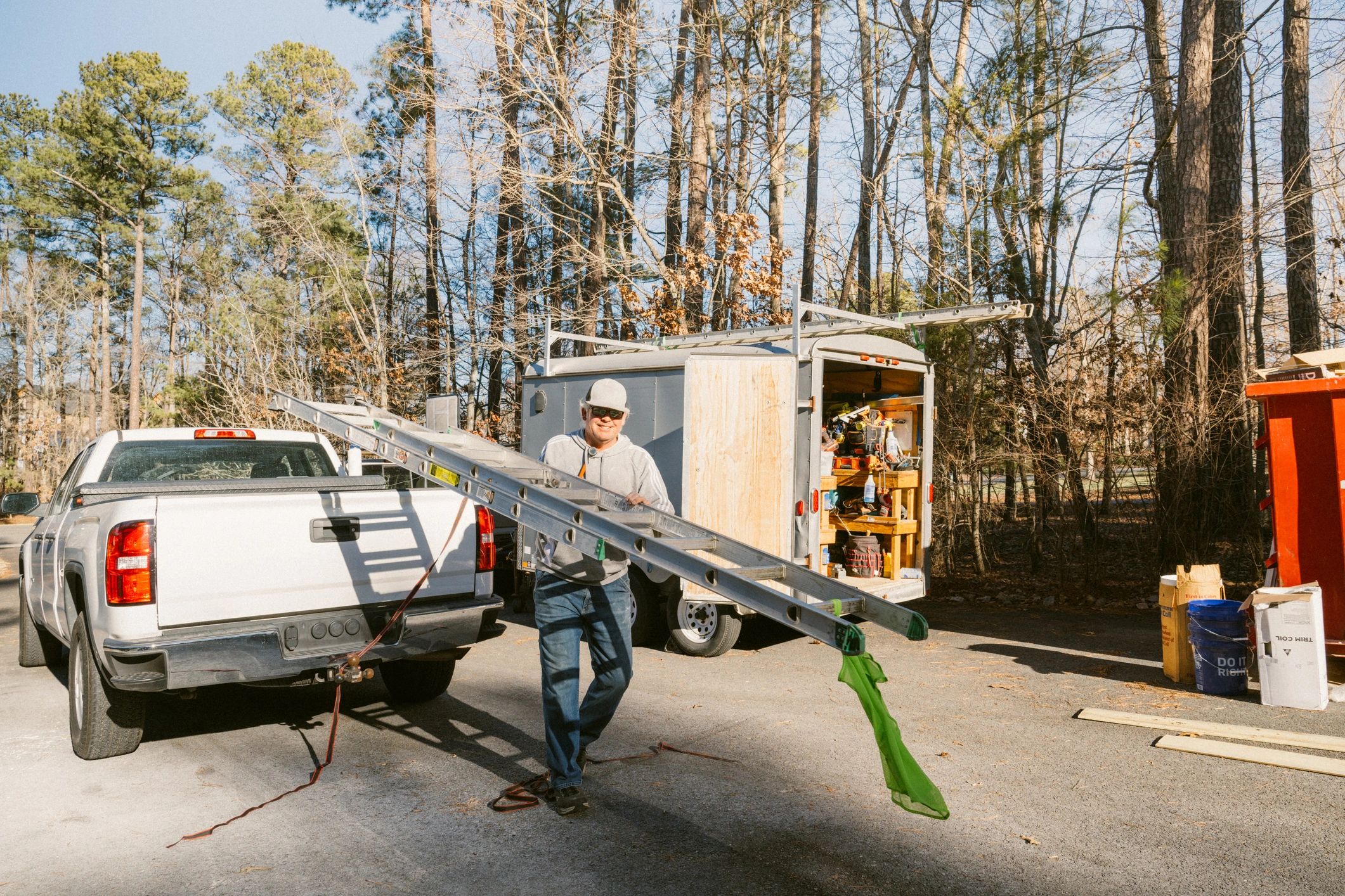 HVAC technician working outside a home during a service visit