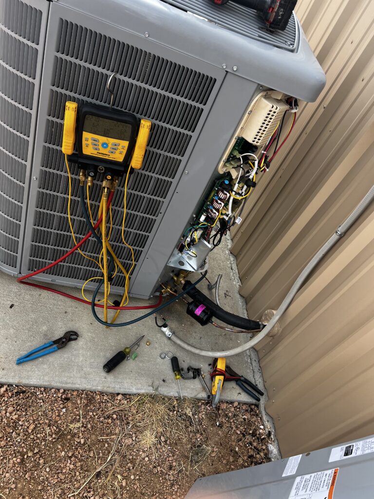AC condenser being serviced.