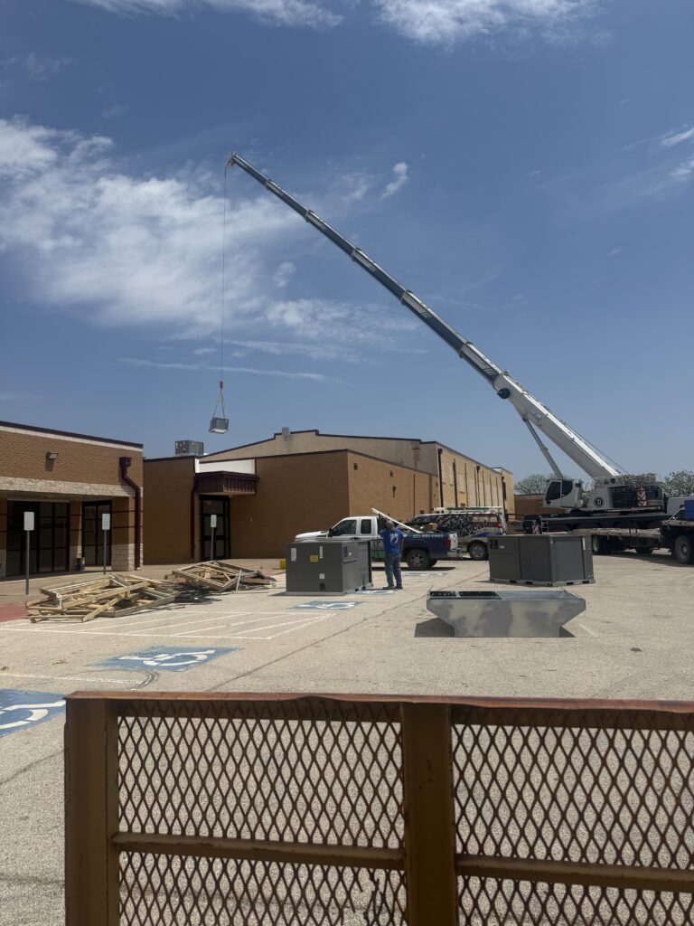 Crane lifting units for a large commercial ac installation project