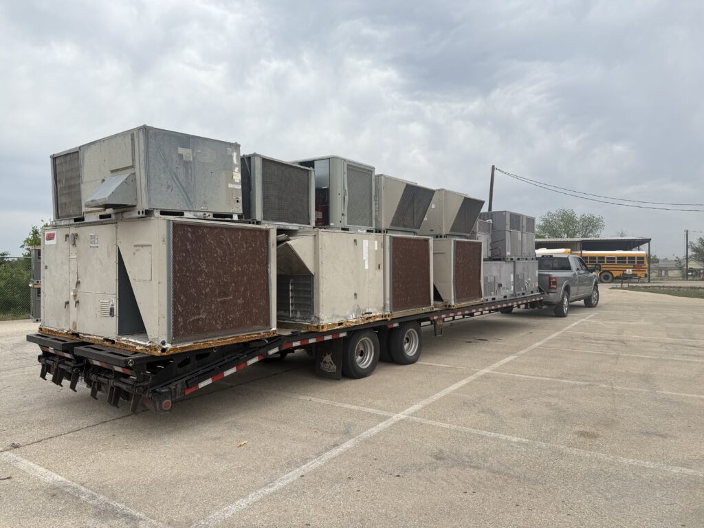 Load of old HVAC units after being replaced on a large building.