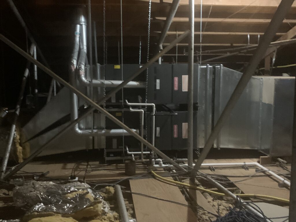 Gas heaters after being serviced in an attic.