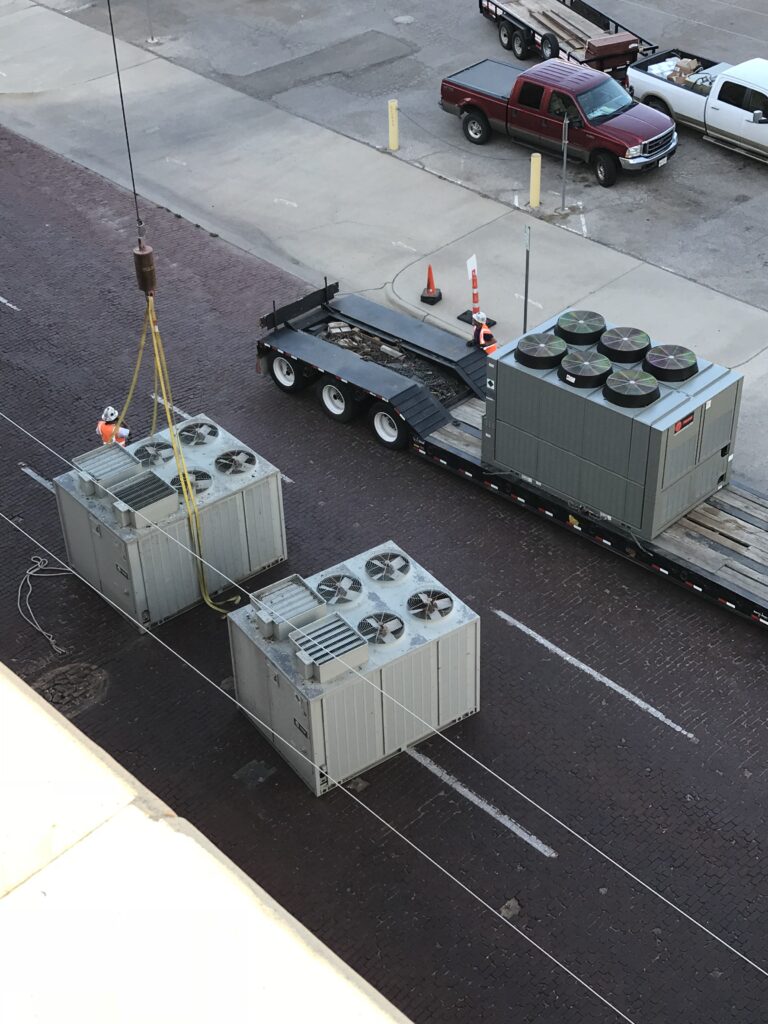 Large chillers being replaced on a large multi story building for a customer.